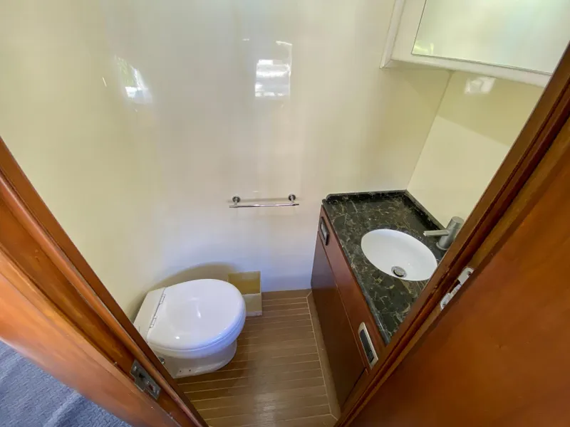 Slide: The Image of Small bathroom in 2007 Rodriquez 80 Widebody yacht with toilet and sink. - 28