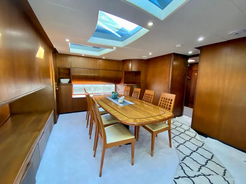 Slide: The Image of Luxurious dining area in 2007 Rodriquez 80 Widebody yacht with skylights and wooden furnishings. - 30