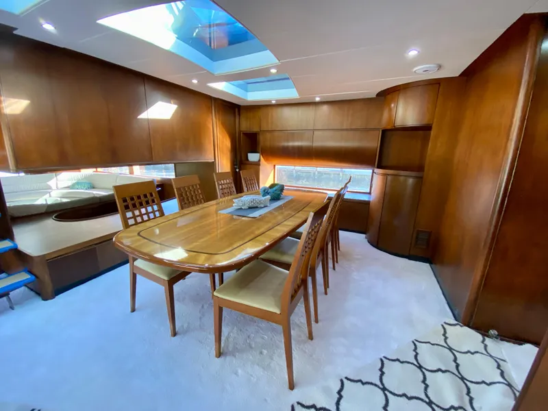 Slide: The Image of Luxurious dining area in a 2007 Rodriquez 80 Widebody yacht with wooden interiors. - 31