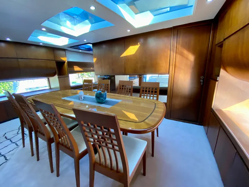 Slide: The Image of Luxurious dining area in a 2007 Rodriquez 80 Widebody yacht with skylights and wooden decor. - 32