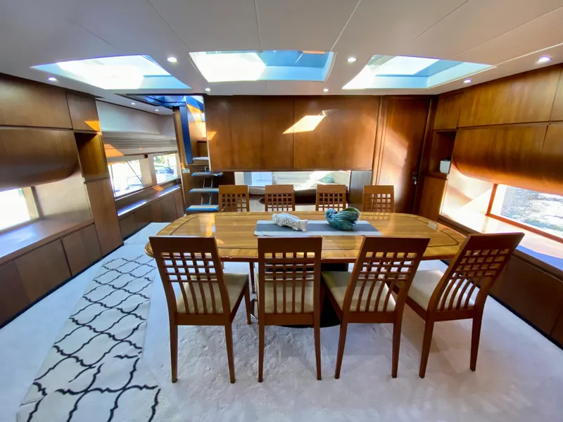 Slide: The Image of Luxurious dining area on 2007 Rodriquez 80 Widebody yacht with skylights and elegant wood finishes. - 33