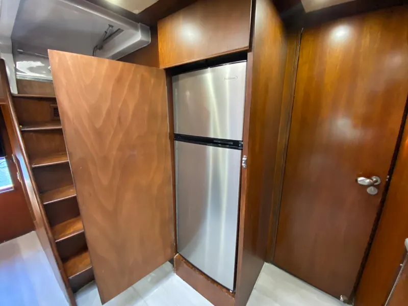 Slide: The Image of Wood-paneled interior of 2007 Rodriquez 80 Widebody yacht with stainless steel refrigerator. - 38
