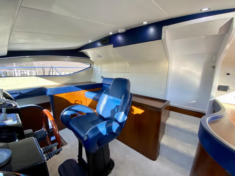 Slide: The Image of Luxurious interior of 2007 Rodriquez 80 Widebody yacht with blue captain's chair and modern helm. - 41