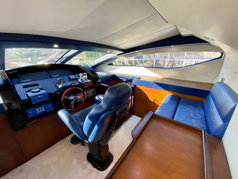Slide: The Image of Interior of 2007 Rodriquez 80 Widebody yacht with blue seating and modern helm. - 42