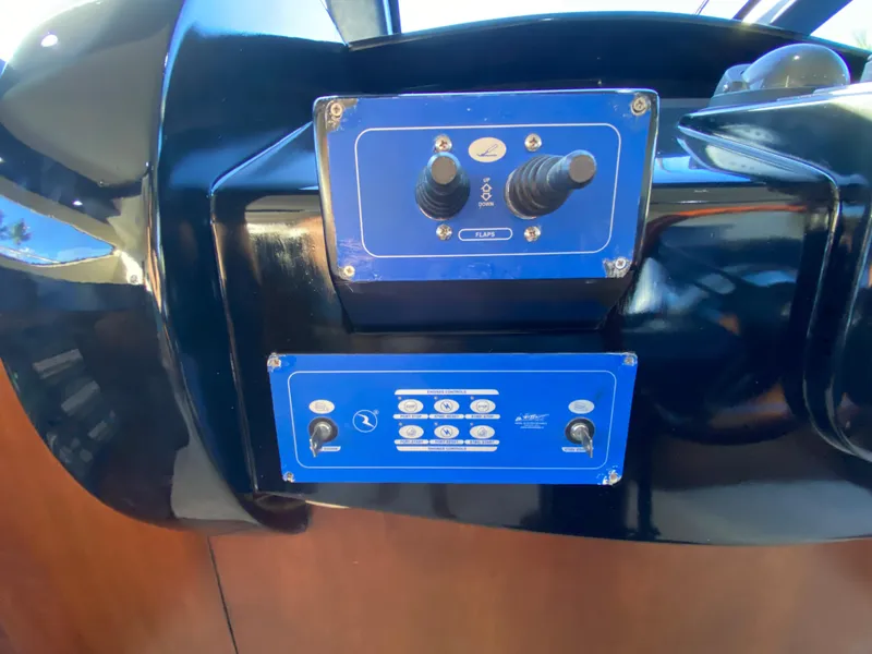 Slide: The Image of Control panel on a 2007 Rodriquez 80 Widebody yacht, featuring blue interface and joysticks. - 47