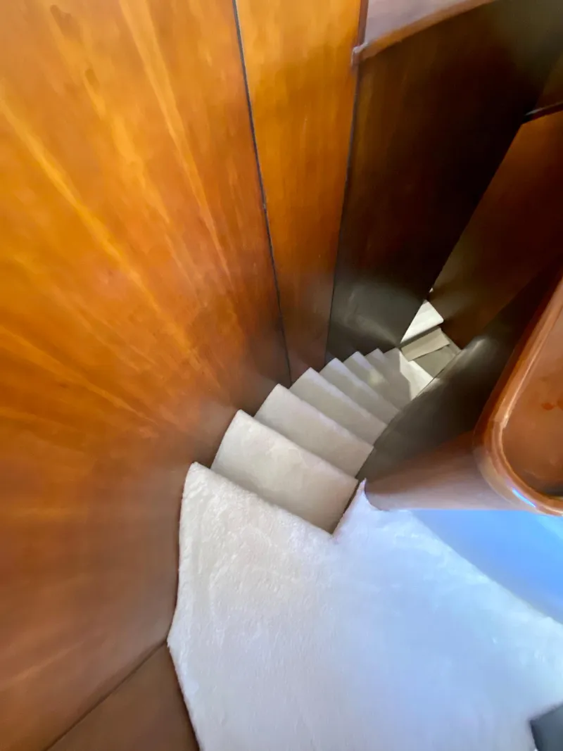 Slide: The Image of Staircase inside 2007 Rodriquez 80 Widebody yacht with wooden paneling. - 48