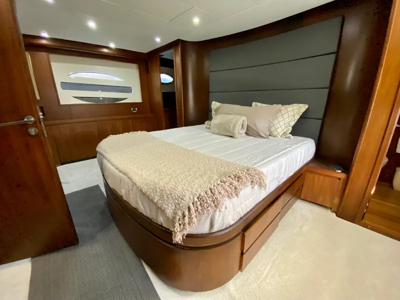 Slide: The Image of Luxurious bedroom interior of 2007 Rodriquez 80 Widebody yacht with elegant bedding and wood finishes. - 49