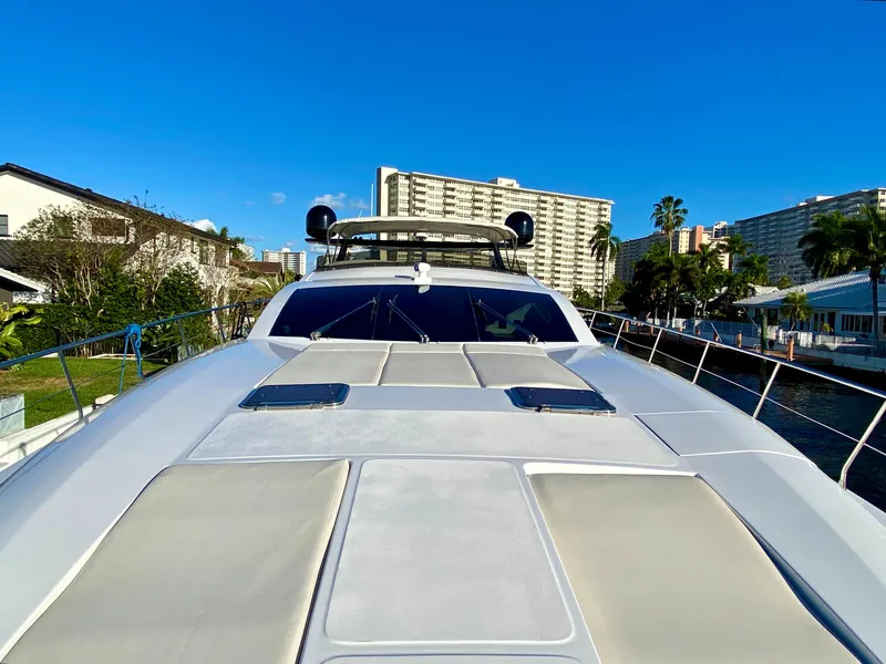 Slide: The Image of Luxury Rodriquez 80 Widebody yacht, 2007 model, docked with cityscape background. - 5