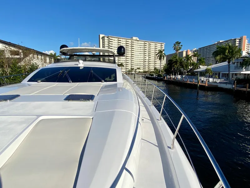 Slide: The Image of Luxury Rodriquez 80 Widebody yacht, 2007 model, docked near waterfront buildings under clear blue sky. - 6