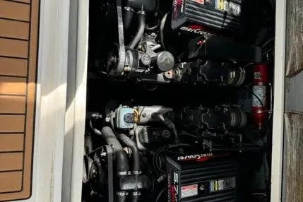 Slide: The Image of 1996 Sea Ray 290 Sundancer engine compartment with dual MerCruiser engines. - 11