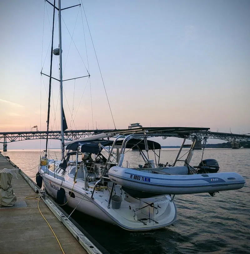 Slide: The Image of Sailboat docked at sunset, Hunter 380, 2001 model, near a bridge. - 13