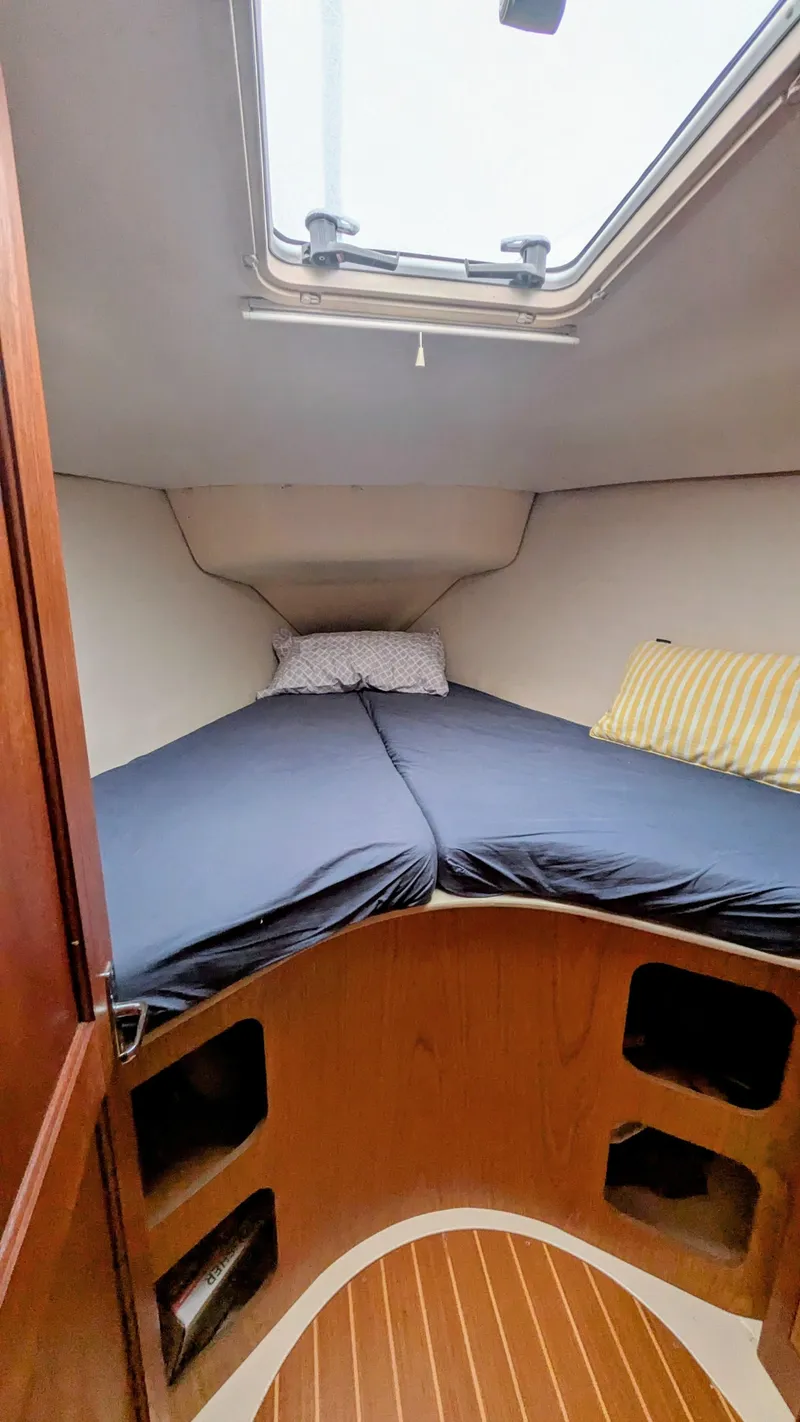 Slide: The Image of Cozy cabin interior of 2001 Hunter 380 sailboat with skylight and bedding. - 22