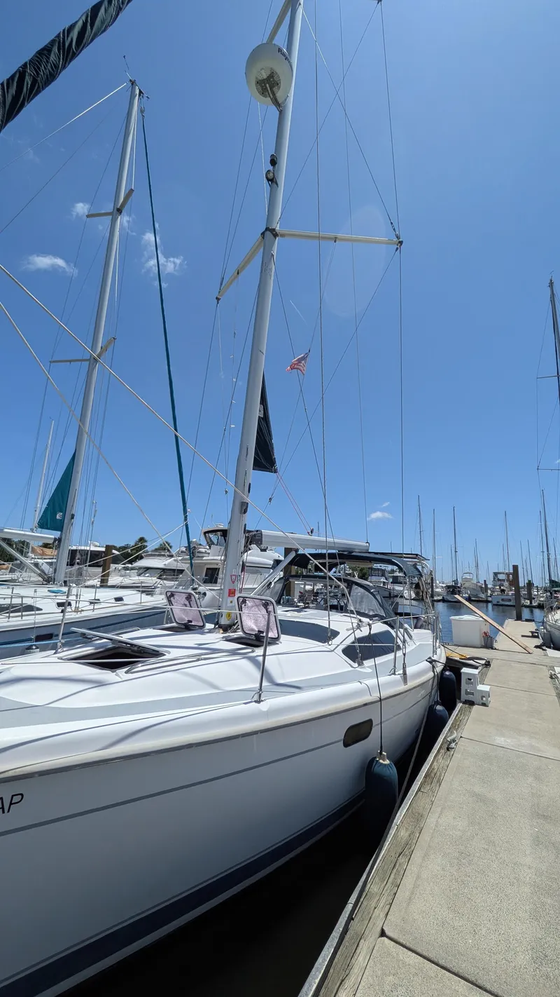 Slide: The Image of Sailboat docked at marina, Hunter 380 model, 2001, under clear blue sky. - 3