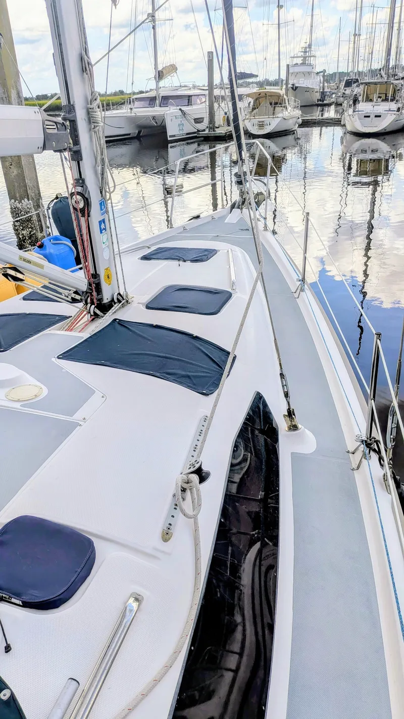 Slide: The Image of Sailboat Hunter 380, 2001 model, docked in marina with other boats in background. - 6