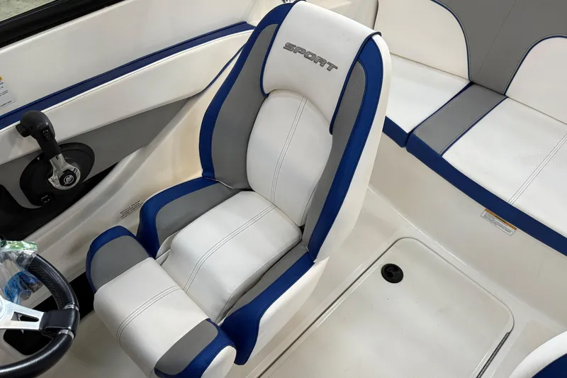 Slide: The Image of 2012 Sea Ray 190 Sport boat interior with white and blue seating. - 5