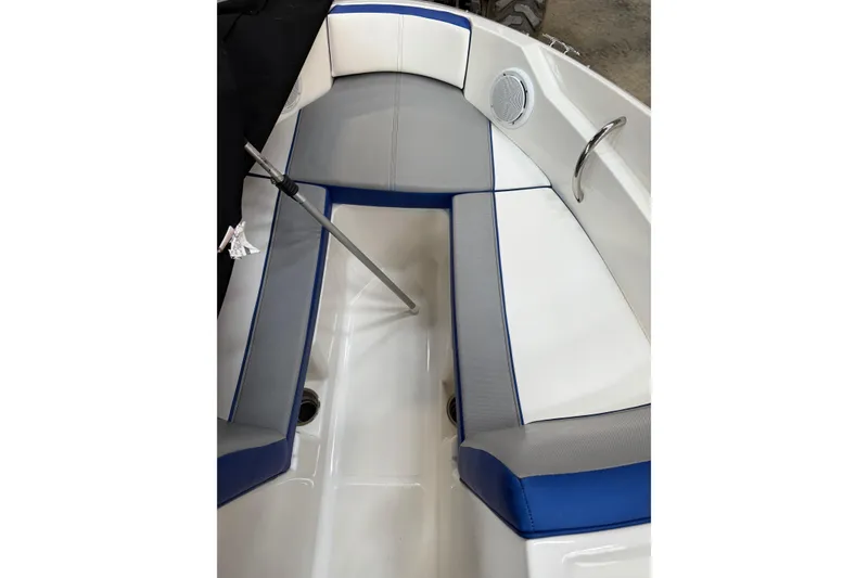 Slide: The Image of 2012 Sea Ray 190 Sport boat interior with blue and gray seating. - 9