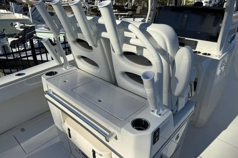 Slide: The Image of 2026 Cobia 265 Open Center Console boat with rod holders and seating. - 16