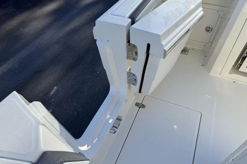 Slide: The Image of 2026 Cobia 265 Open Center Console boat with open side door detail. - 20