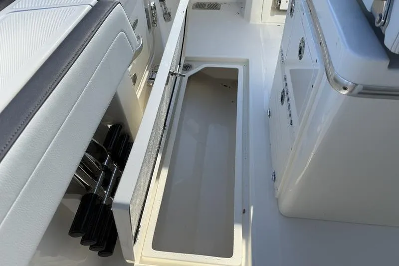 Slide: The Image of 2026 Cobia 265 Open Center Console boat interior storage compartment. - 25
