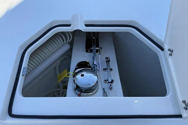 Slide: The Image of Anchor compartment of 2026 Cobia 265 Open Center Console boat. - 32