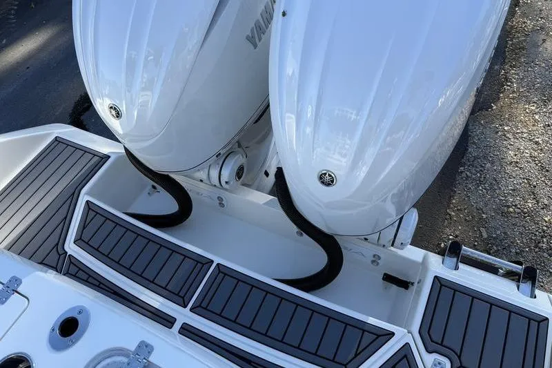 Slide: The Image of 2026 Cobia 265 Open Center Console with dual Yamaha outboard engines. - 33
