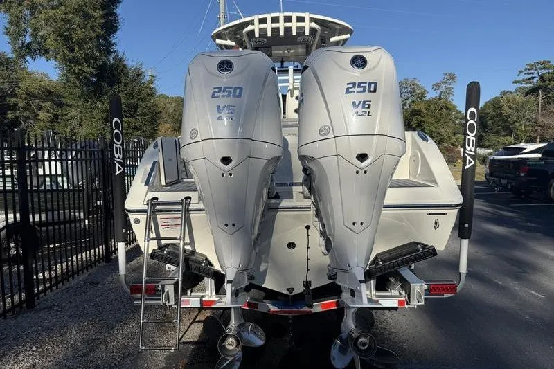 Slide: The Image of 2026 Cobia 265 Open Center Console with twin 250 V6 outboard engines. - 4