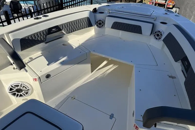 Slide: The Image of 2026 Cobia 265 Open Center Console boat interior with seating and storage compartments. - 6