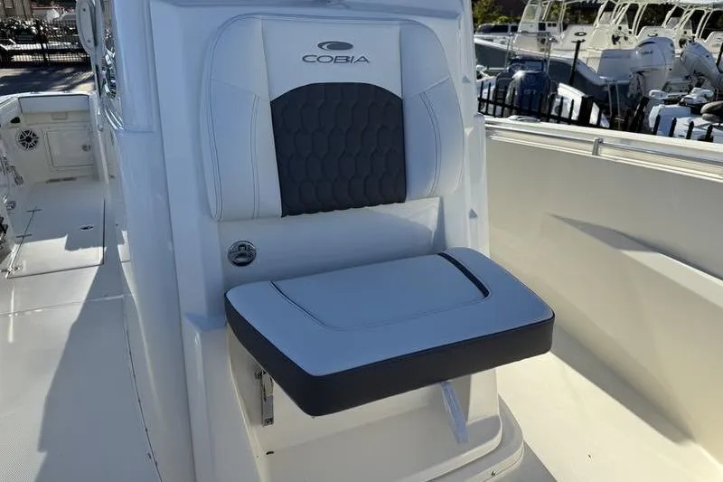 Slide: The Image of 2026 Cobia 265 Open Center Console boat seat, featuring sleek design and comfortable cushioning. - 8