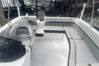 Slide: The Image of 2022 Hurricane SunDeck Sport 192 RL OB boat interior with spacious seating and modern design. - 10