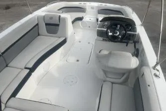 Slide: The Image of 2022 Hurricane SunDeck Sport 192 RL OB boat interior with sleek seating and modern dashboard. - 7