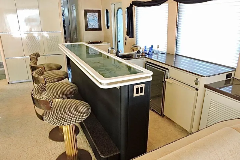 Slide: The Image of Luxurious bar area inside a 1992 Christensen motor yacht with stylish seating and modern amenities. - 12