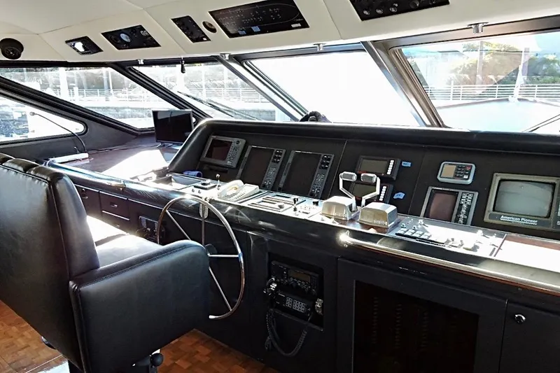 Slide: The Image of Cockpit of a 1992 Christensen Motor Yacht with navigation instruments and steering wheel. - 16
