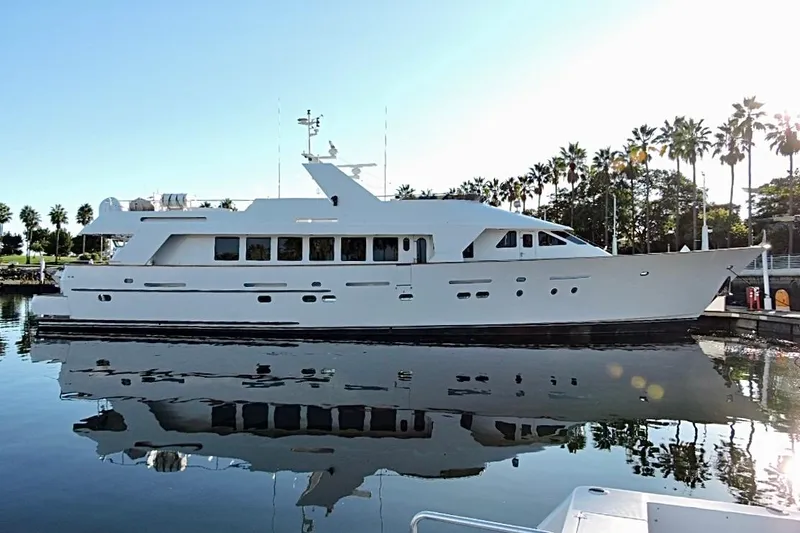 Slide: The Image of Luxurious 1992 Christensen motor yacht "Entrepreneur" docked at sunset, showcasing elegant design. - 2
