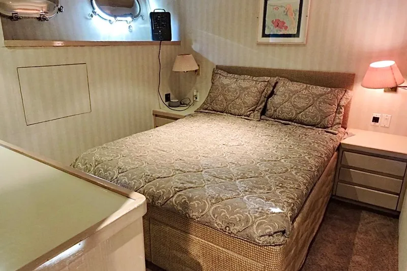 Slide: The Image of Luxurious bedroom interior on 1992 Christensen Motor Yacht with elegant bedding and soft lighting. - 22