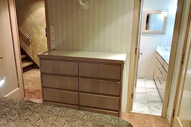 Slide: The Image of Luxurious interior of 1992 Christensen motor yacht with elegant bedroom and bathroom. - 23