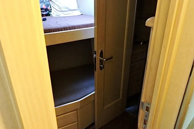 Slide: The Image of Bunk beds in a 1992 Christensen motor yacht cabin interior. - 27