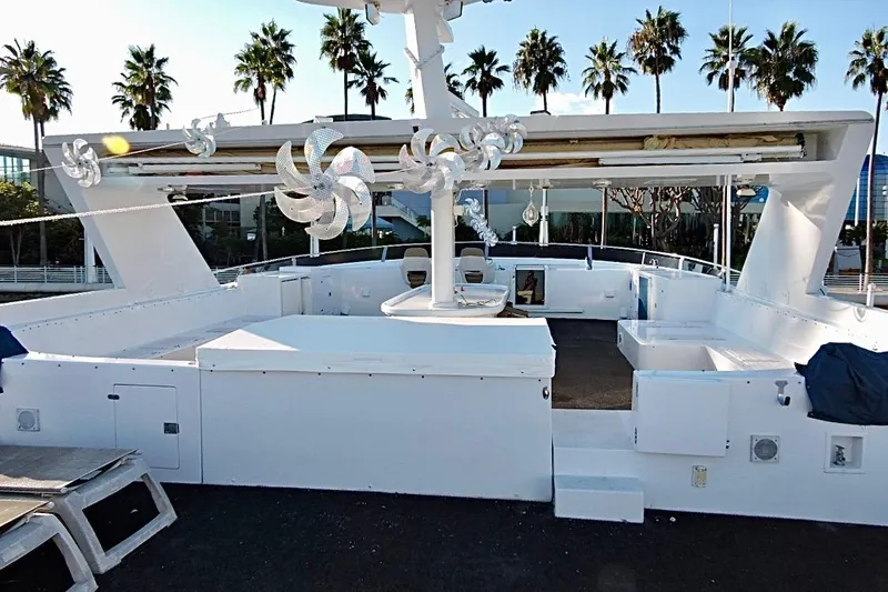 Slide: The Image of Luxurious 1992 Christensen Motor Yacht deck with modern amenities and scenic marina view. - 35