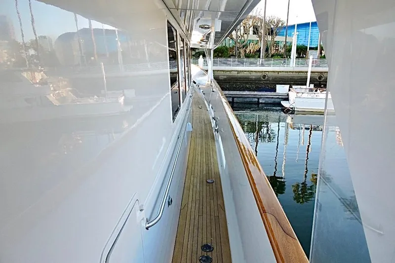 Slide: The Image of Luxurious 1992 Christensen motor yacht docked, featuring sleek design and spacious deck. - 47