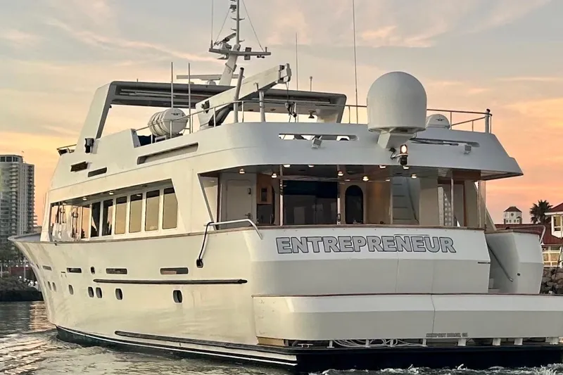 Slide: The Image of Luxurious 1992 Christensen motor yacht docked in a serene marina setting. - 6