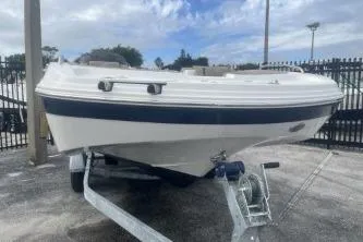 Slide: The Image of 2021 Hurricane SunDeck Sport 192 RL OB boat on trailer, parked outdoors. - 4