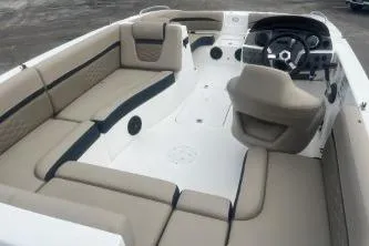 Slide: The Image of 2021 Hurricane SunDeck Sport 192 RL OB boat interior with beige seating and steering console. - 6