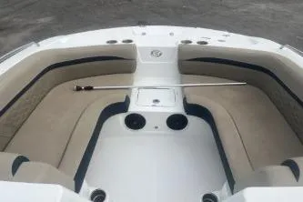 Slide: The Image of 2021 Hurricane SunDeck Sport 192 RL OB boat interior with beige seating and storage compartments. - 9