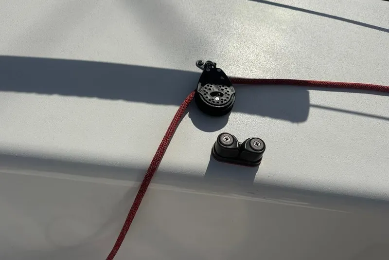 Slide: The Image of Close-up of a 2016 J Boats J/70 sailboat deck with red rope and pulley system. - 10