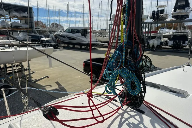 Slide: The Image of 2016 J Boats J/70 sailboat with colorful rigging in a marina setting. - 14