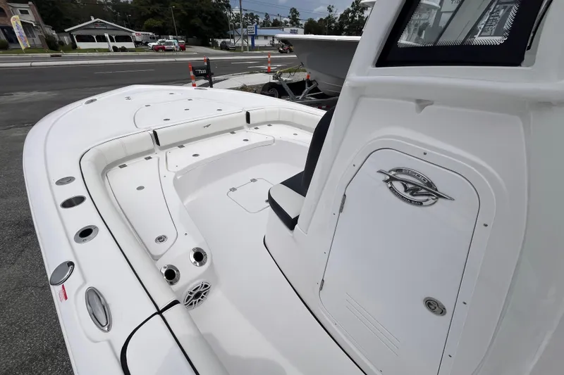 Slide: The Image of 2026 Tidewater 2500 Carolina Bay boat interior with seating and storage compartments. - 11