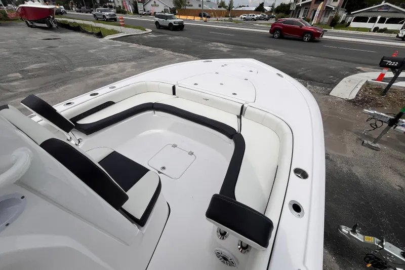 Slide: The Image of 2026 Tidewater 2500 Carolina Bay boat interior with sleek seating and storage compartments. - 14