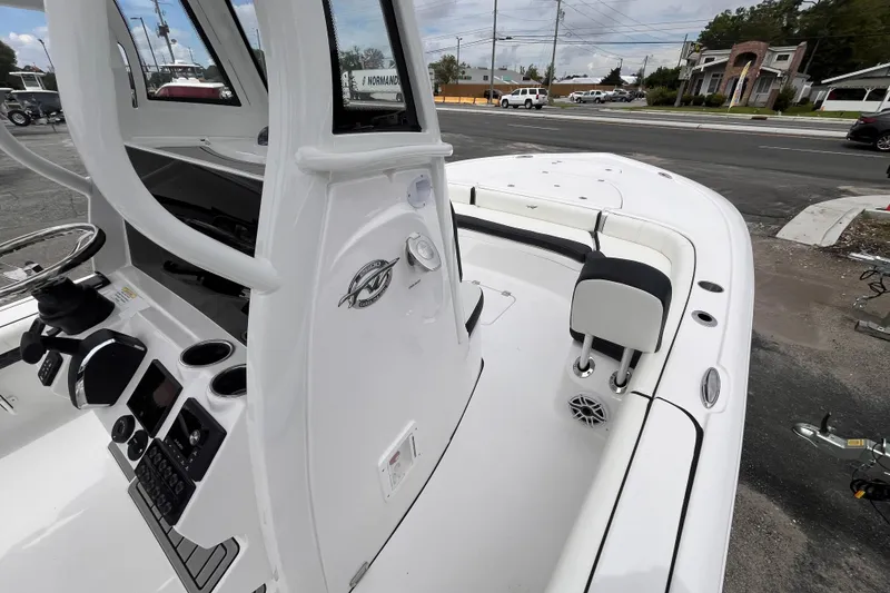 Slide: The Image of 2026 Tidewater 2500 Carolina Bay boat interior with steering console and seating. - 15