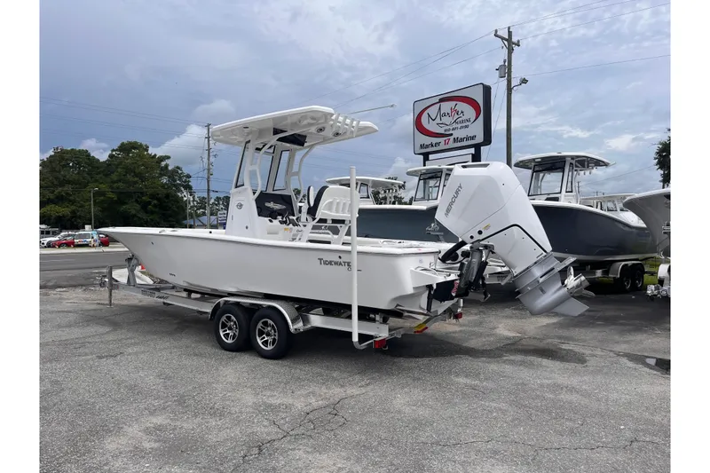 Slide: The Image of 2026 Tidewater 2500 Carolina Bay boat on trailer at Marker 17 Marine dealership. - 2