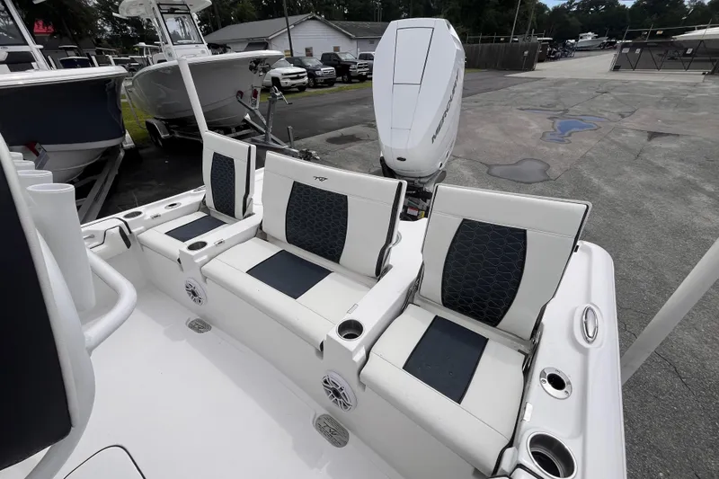 Slide: The Image of 2026 Tidewater 2500 Carolina Bay boat seats with modern design and cup holders. - 6