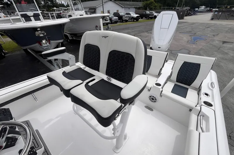 Slide: The Image of 2026 Tidewater 2500 Carolina Bay boat interior with stylish seating and modern design. - 7